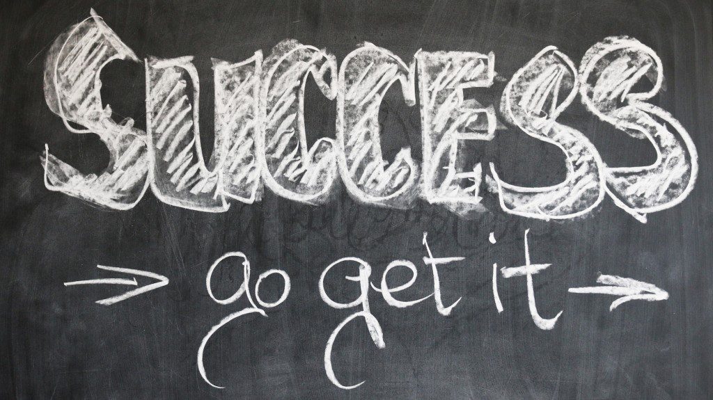 chalkboard with the word success written on it