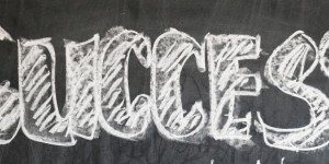 chalkboard with the word success written on it